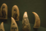 Whale teeth scrimshaw