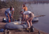 Students pumping up rafts