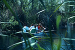 Students rowing on lake