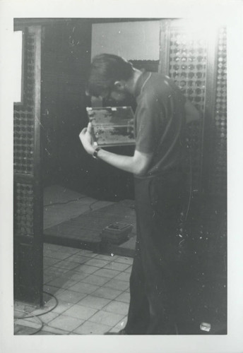 Scholar holding Nag Hammadi codices