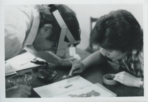 James Robinson and Anita Weisbrod Robinson work in the Coptic Museum