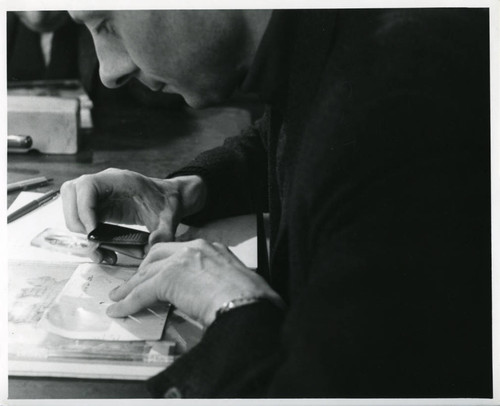 Hans-Martin Shenke studying manuscript