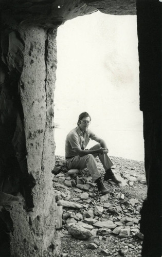 Robinson seated outside T 8 cave