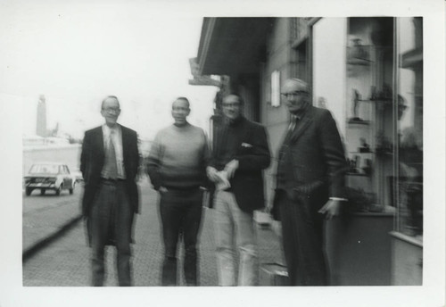 Charles Hedrick, John Turner, George McRae, and John Barns standing on sidewalk