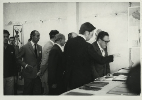 Henry Kissinger and James Robinson examine texts at the Coptic Museum