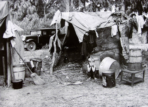 Child in Doorway of Shack of Migrant Pickers