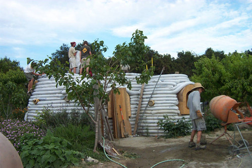 Students at Earth Dome with clouds overhead