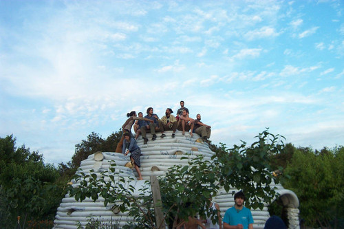 Students sitting on uncompleted Earth Dome