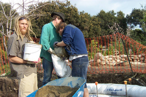 Student holds bucket