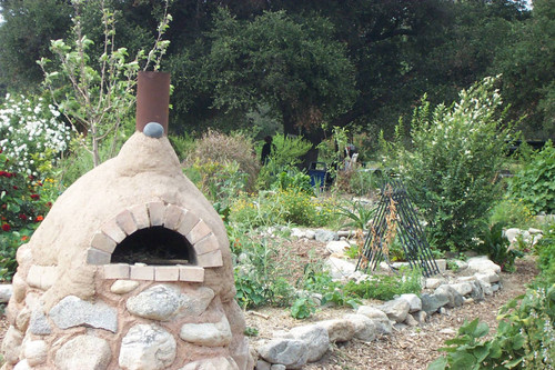 Cob oven with figure facing away