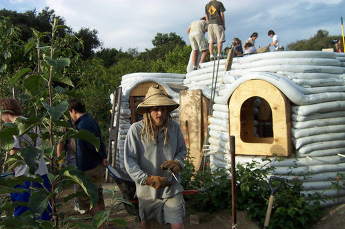 Student in hat near Earth Dome