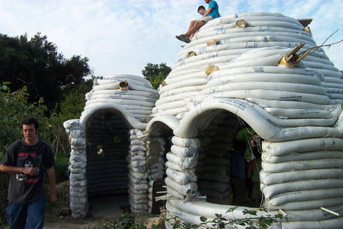 Students sitting atop unfinished Earth Dome