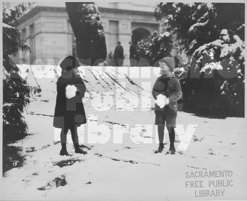 Two Children on a Snowy Day on the Capitol Building Grounds