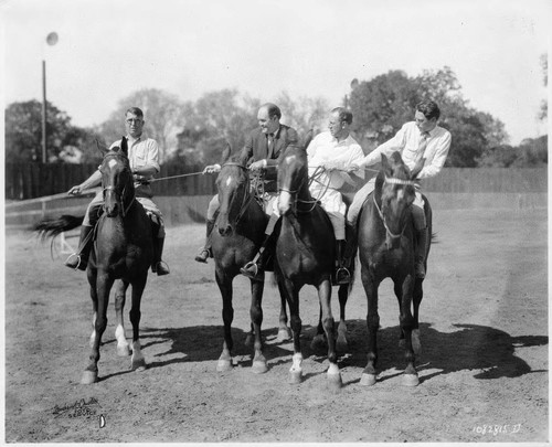 Four men on horseback