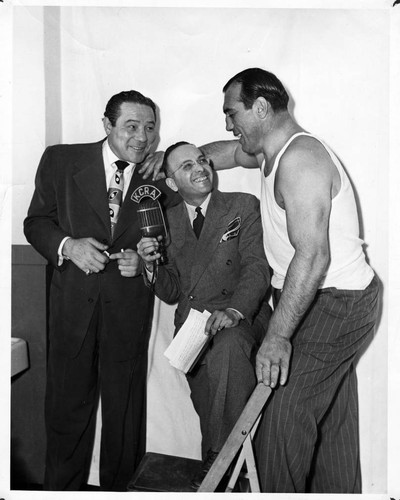 Boxers Max Baer and Primo Carnera with announcer Steve George