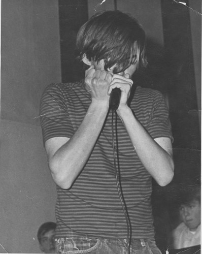 Young Charles Baty playing harmonica