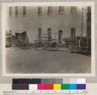 Ancient and modern fire trucks at San Andreas, 1930. The new State outfit on Moreland 2 ton chassis, carries 225 gallons of water, 105 gallon back-pack pump outfits, 1500 feet of hose and hand tools