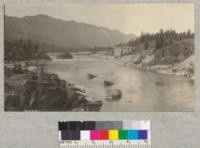 Thompson Falls, Montana. The Power City. Looking down Clark's Fork with Power house. Cabinet National Forest slopes in background