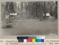 Stanislaus 4-H Club camp site at Pinecrest in Stanislaus National Forest. The new cabin to left. Commissary to right. W. Metcalf. June 1931