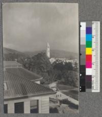 A view of the Campanile from the roof of Hilgard Hall. Charter Day. March 23, 1918, with service flag flying beneath the clock