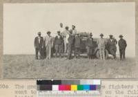 The group of rangers and fire fighters who went to the top of Bald Peak on the fully loaded tank fire truck built by O. Hirst of Placerville. W. Metcalf - July 1931