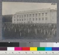 View of Hilgard Hall from the forest nursery. Stakes in the foreground are in the experimental tobacco area. Metcalf, 1917