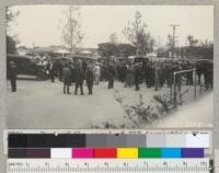 Part of the crowd of 350 inspecting fire trucks at the Rural Fire Institute at Pomona, April 1938. Metcalf