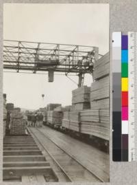 Gantry crane in storage yard for common lumber. Transfer car from dock spotted at right. Coos Bay Lumber Company, October, 1921. E.F