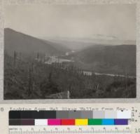 Looking down Eel River Valley from Sec. 1, T2S, R2E, Humboldt Meridian. South Fork & Main Eel join under hill in foreground. South Fork Station at left. Railroad bridge in center