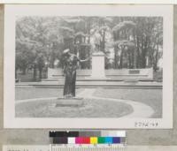 Arbor Lodge State Park, Nebraska City, Nebraska. Symbolic figure of Arbor Day and statue of J. Sterling Morton. White pines in rear; Ginkgo left. Inscription on bench "Love of home is primary patriotism, other holidays repose upon the past. Arbor Day proposes for the future." Metcalf. Sept. '53