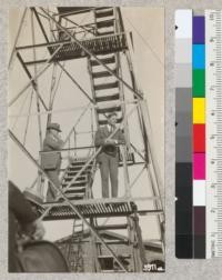 Mr. Paul Daniels, Chairman, and Charles Keeler, Secretary, of the Contra Costa Hills Protection Committee at the Grizzly Peak lookout tower. The latter is speaking to the crowd on the occasion of the dedication of the tower, Sept. 18, 1924