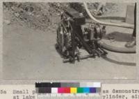 Small portable pumping unit as demonstrated at Lake Chabot. It has a 2 cylinder, air-cooled, engine of English make. W. Metcalf - May 1931