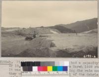 Pickens Canyon debris basin had a capacity of 10,000 cubic yards before the March 1938 storm. It was completely filled up during the rain and they were here beginning removal of the debris which, at the dam, was 10 to 12 feet deep. March 1938. Metcalf