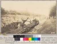 The Pacific Electric Railway cut near Duarte was completely filled with debris which came into it through the orange grove at the left. This cut has been filled in at least one previous storm. March 1938. Metcalf