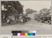 Explaining the use of hand fire tools at Oakdale demonstration, Stanislaus County. Metcalf. May, 1928