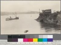 Loading lumber on vessels from cable chute house at right. Note package of lumber intransit. Mendocino Lumber Company, Mendocino, California. May, 1920. E. F