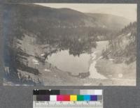 Lake below cliffs shown in #118. Flatiron Mountain, Montana. Head of Hawkins Creek. Montana 1920