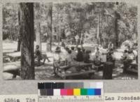 The dining table area at Las Posadas forest camp in Napa County made a convenient place for first aid demonstration. Metcalf. July, 1928