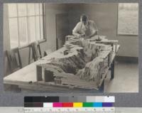 A. F. Hall constructing relief model of Yosemite Valley, Spring 1921. University of California