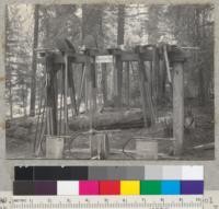 Camp Califorest. Fire tool and camp tool rack built July, 1939 by Professor Barr. 7-39. E.F