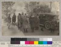 Group of Rangers and newspaper men on morning of first entering Yosemite Valley over Merced River Route. Group just augmented by arrival of Superintendent Lewis' car from valley at road camp. January 21, 1926