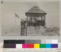 A group of 4-H girls from Tulare and Kings Counties at Buck Rock lookout station, near Whitaker's Forest. Forest Ranger Stevenson and Lookout Vanderloof explained methods of locating, reporting and combating forest fires. Metcalf. 1927