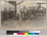 California Barrel Company, Arcata, California. Woods operators near Exeter. Sitka spruce cut into stave bolts. Picture shows drag-saw cutting logs into bolts and crew using hand wedges and axes for splitting