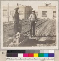 Two ranchers in the Antelope Valley who helped at the tree planting activity. Lancaster, 1930. Los Angeles Farm Advisor Film