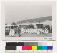 California 4-H Club Convention, Davis. The delegates disembark from the buses in front of the 4-H Building at the California State Fair