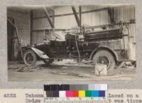 Tehama County fire pumper placed on a new Dodge chassis this year. It was tipped over on the road near Red Bluff shortly before this picture was taken. It is in the charge of County Fire Warden, and has good hand equipment, a 35-gallon chemical tank and an Evinrude auxiliary pump from the tank. Metcalf. 1928