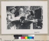 Two students take down some references from Woodbridge Metcalf after talk at the Convention Workshop, Idyllwild. July 1952. Metcalf