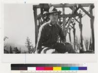 Emanuel Fritz riding a lumber load on the Meadow Valley Grays Flat lumber tramway. c.1926