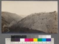 Waste land in Wallowa River Canyon. The town of Wallowa, Oregon, in the valley