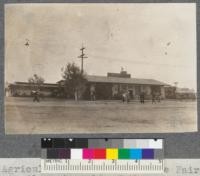 College of Agriculture exhibit at State Fair, Sacramento, California, 1918. Fire trailer at right of the side entrance from Solano County